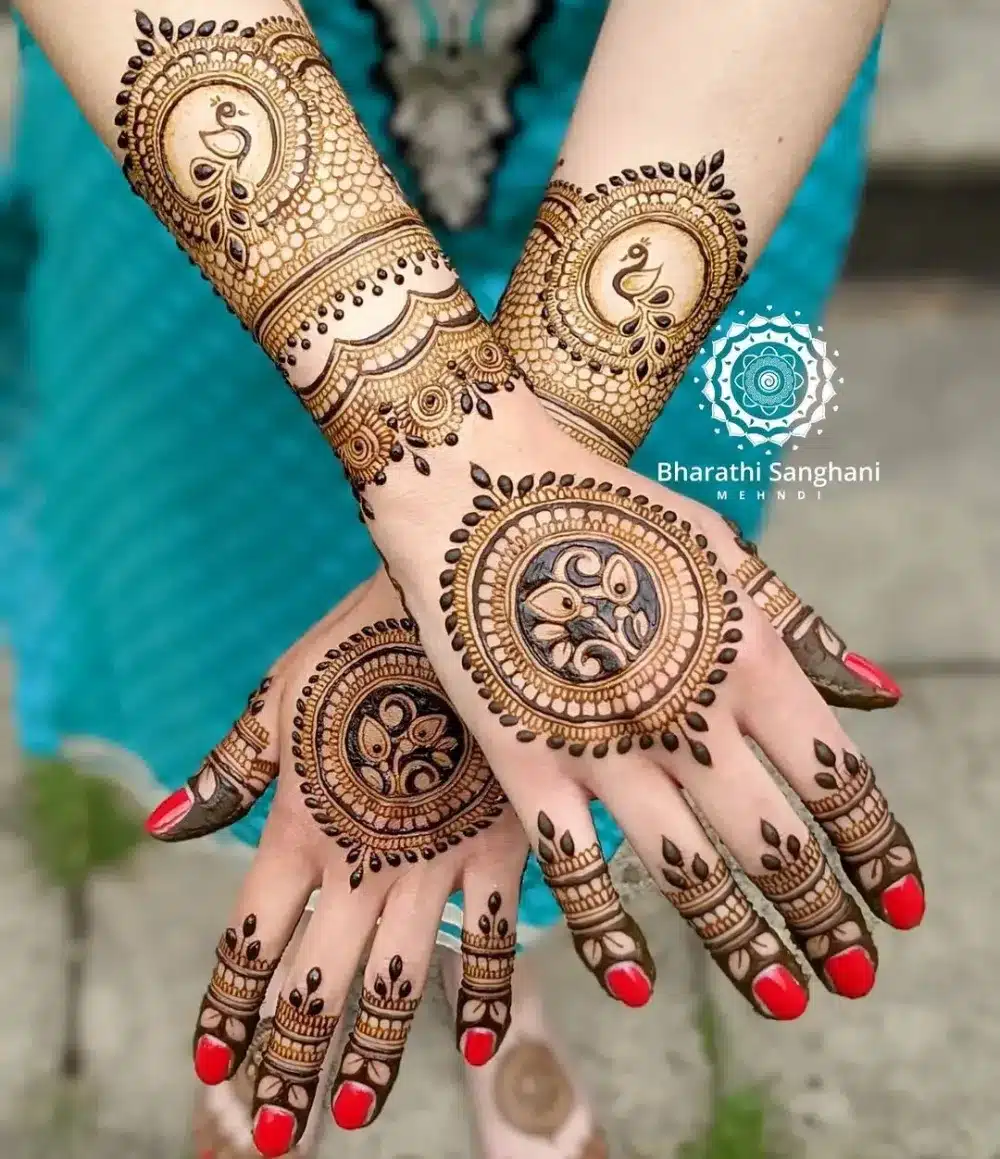 Gorgeous Mehndi Design with Peacock Motifs and Some Jhumkas
